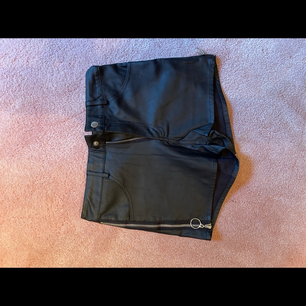 Leather shorts with zippers on side